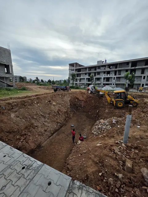 Excavator working the foundation area - Mr. Arjun project, RR Nagar