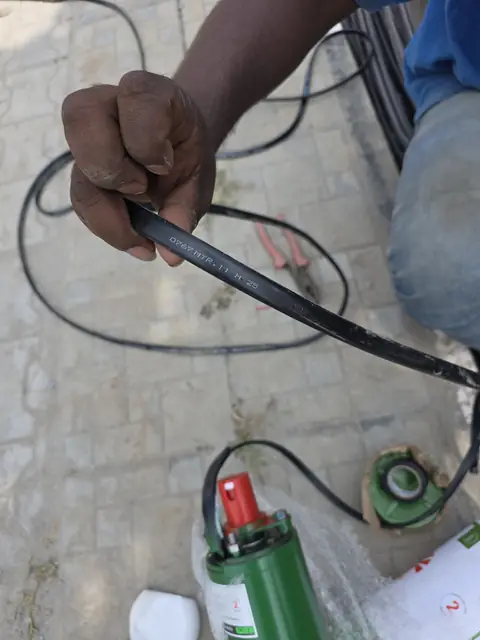 Borewell pump cable prepared for lowering - Mr. Arjun project, RR Nagar