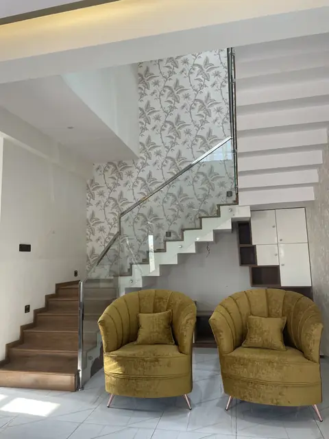 Stairwell lounge with wallpapered feature wall - Mr. Nagaraj project, Bangalore