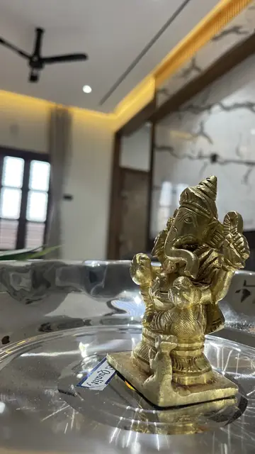 Brass idol detail on polished surface - Mr. Nagaraj project, Bangalore