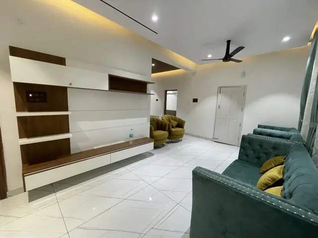 Family room with wall-mounted television unit - Mr. Nagaraj project, Bangalore