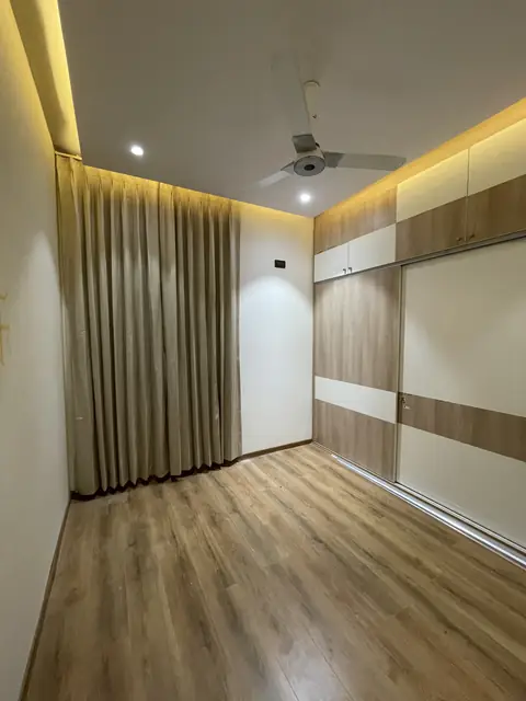 Bedroom with wooden flooring and curtains - Mr. Nagaraj project, Bangalore