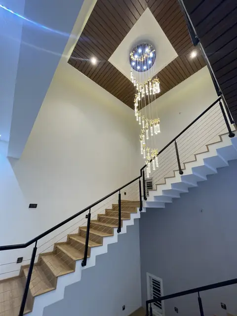 Chandelier hanging over the stair void - Mr. Ranjith project, Bangalore