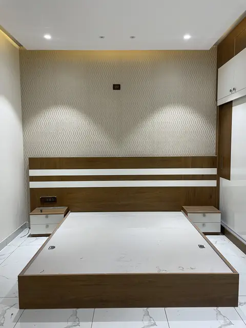 Bedroom with textured wall and bedside units - Mr. Ranjith project, Bangalore