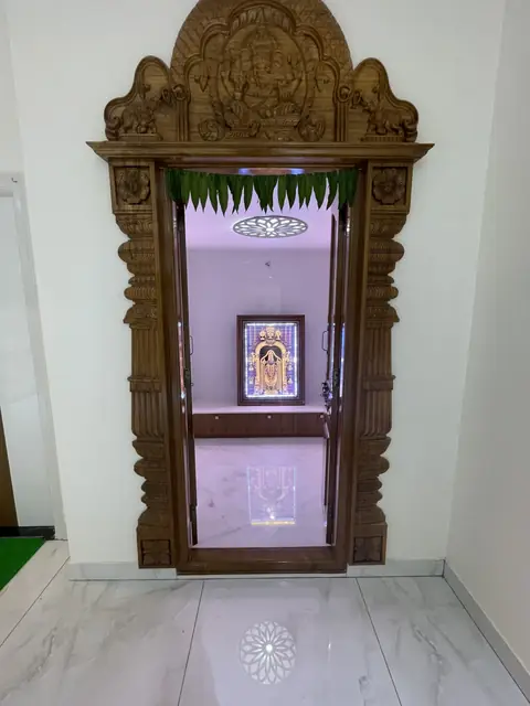 Carved wooden pooja mandir with backlit niche - Mr. Ranjith project, Bangalore