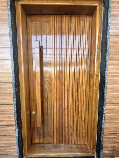 Panelled wooden main door in frame - Mr. Ranjith project, Bangalore