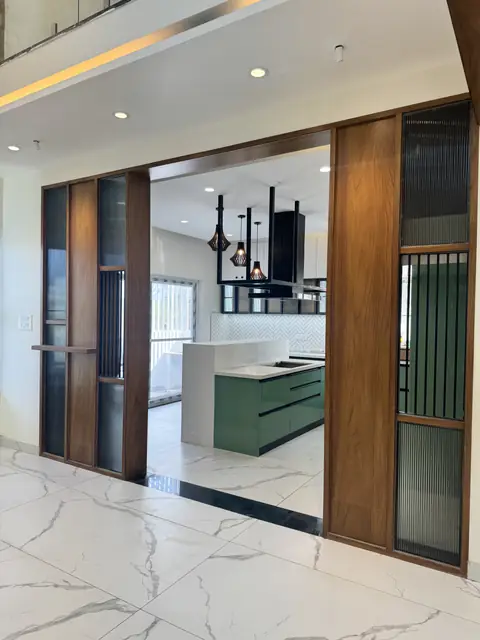 Partition screen framing the island kitchen - Mr. Ranjith project, Bangalore