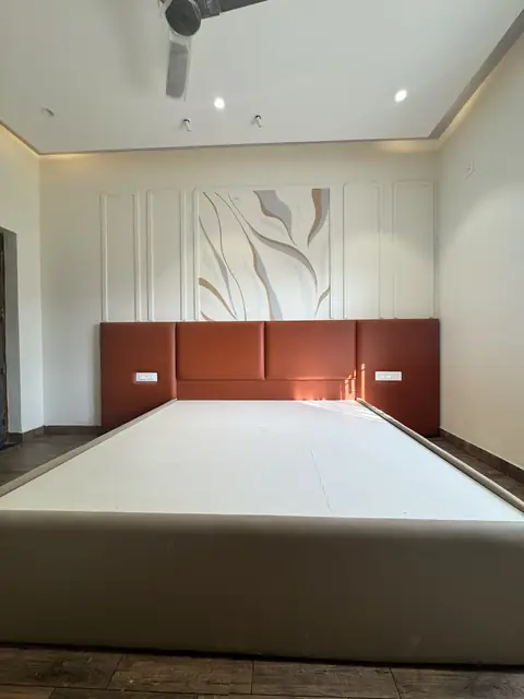 Bed against textured white feature wall - Mr. Ranjith project, Bangalore