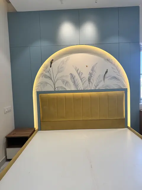 Backlit arch headboard behind upholstered bed - Mr. Ranjith project, Bangalore