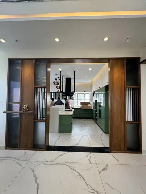 Kitchen viewed through partition opening - Mr. Ranjith project, Bangalore