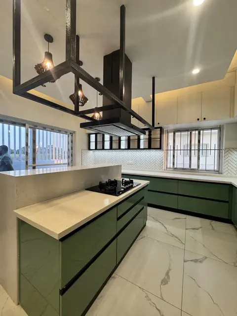 Island kitchen with tall storage units - Mr. Ranjith project, Bangalore