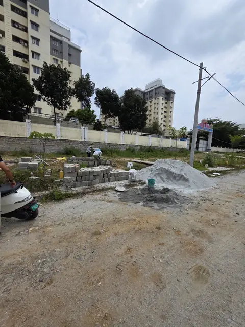 Cleared plot beside the compound wall - Mr. Santosh project, Andrahalli