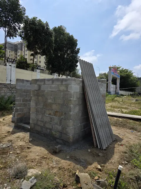 Sheet panels stacked near block wall - Mr. Santosh project, Andrahalli