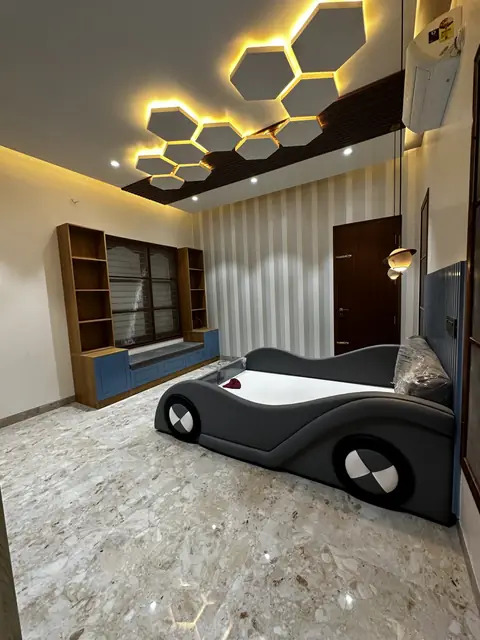 Hexagonal ceiling lights above themed bed - Mr. Siddanth project, Bangalore