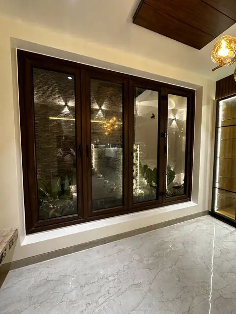 Window bay framed in dark wood panelling - Mr. Siddanth project, Bangalore