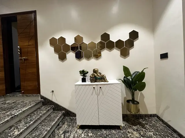 Hexagonal wall panels above white console - Mr. Siddanth project, Bangalore
