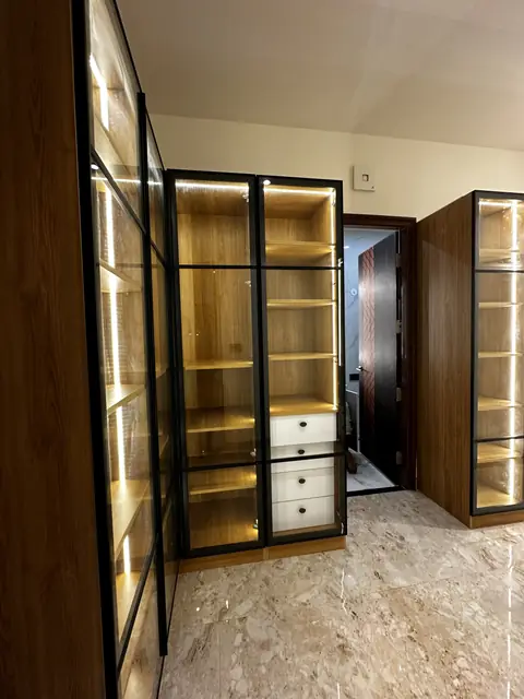 Walk-in wardrobe with lit glass shutters - Mr. Siddanth project, Bangalore