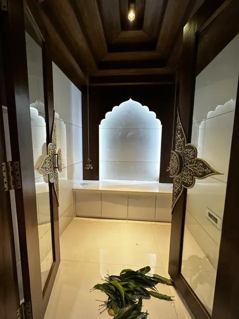Arched pooja niche with wooden pillars - Mr. Siddanth project, Bangalore