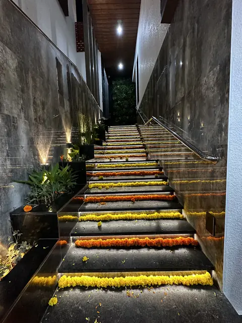 Outdoor stairs decorated with marigold garlands - Mr. Siddanth project, Bangalore