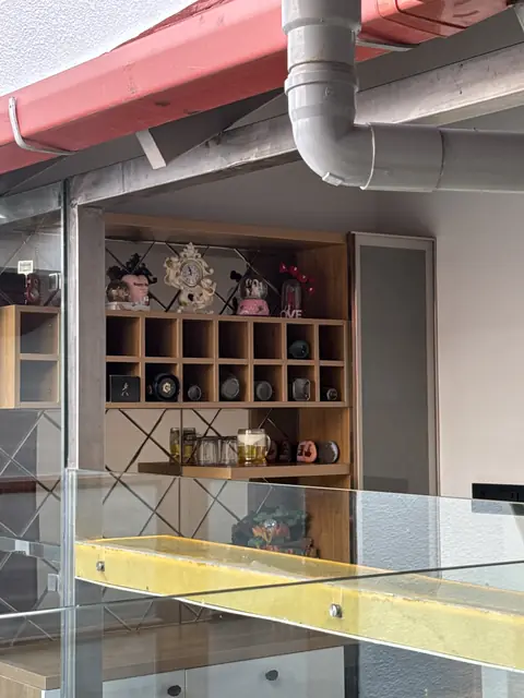 Terrace shelf unit beside glass railing - Mr. Siddanth project, Bangalore