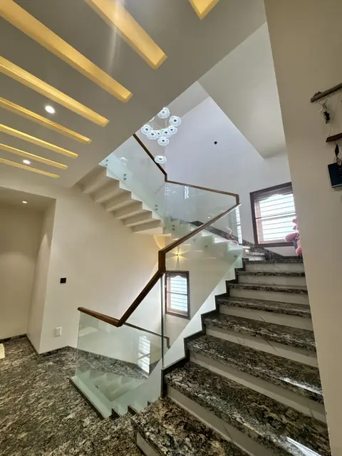 Staircase with glass railing and skylight - Mr. Siddanth project, Bangalore