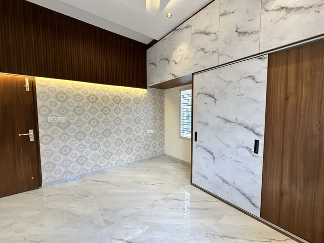 Sliding wardrobe with marble-look wall cladding - Mr. Umesh project, Bangalore