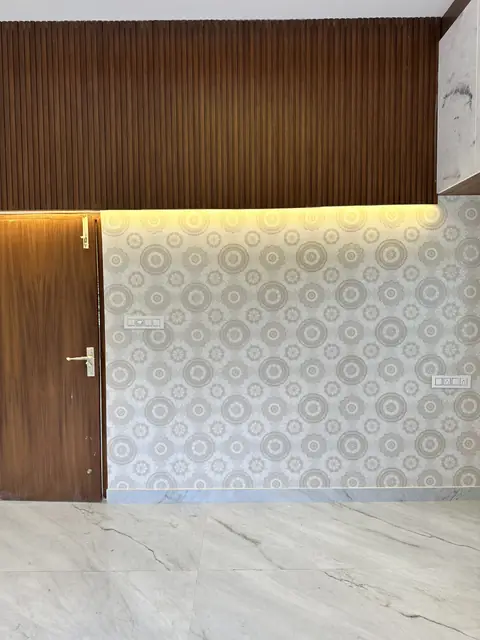 Wooden panelled wall with concealed lighting - Mr. Umesh project, Bangalore