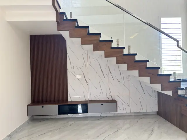 Staircase with glass railing above console - Mr. Umesh project, Bangalore
