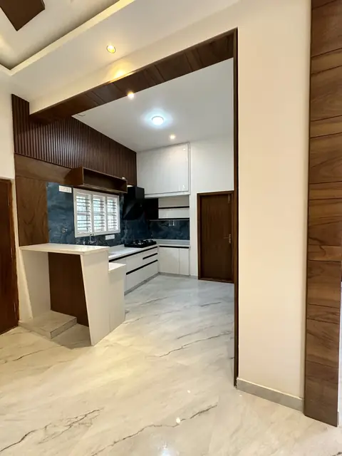 Living area view toward the open kitchen - Mr. Umesh project, Bangalore