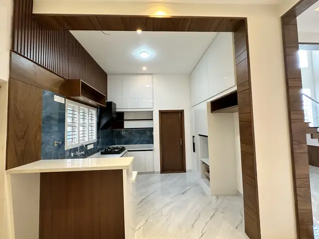 Kitchen island seen from the living area - Mr. Umesh project, Bangalore