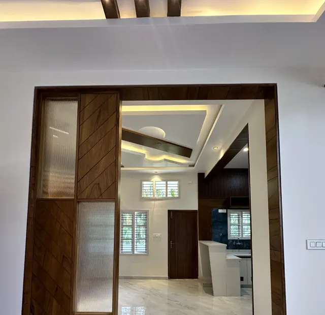 Interior view through wooden portal framing - Mr. Umesh project, Bangalore