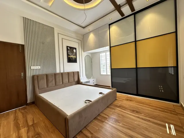Bedroom with upholstered bed and sliding wardrobe - Mr. Umesh project, Bangalore