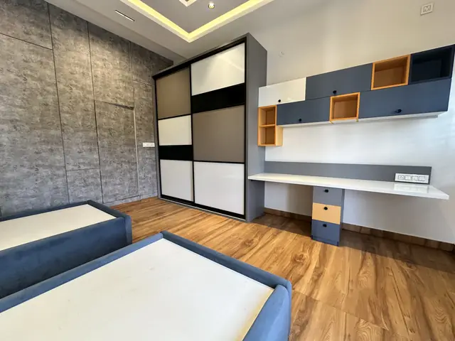 Bedroom with built-in study desk and shelving - Mr. Umesh project, Bangalore