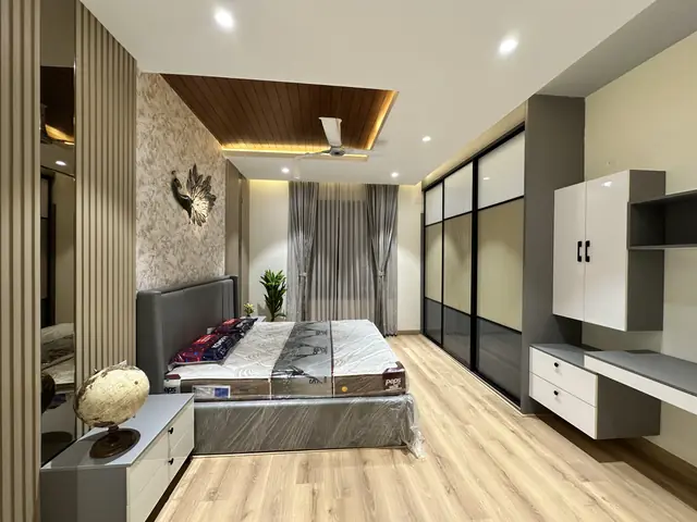 Bedroom with sliding glass wardrobe shutters - Mr. Willfred project, Bangalore