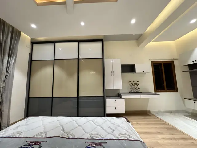 Bedroom with glass partition and dresser unit - Mr. Willfred project, Bangalore