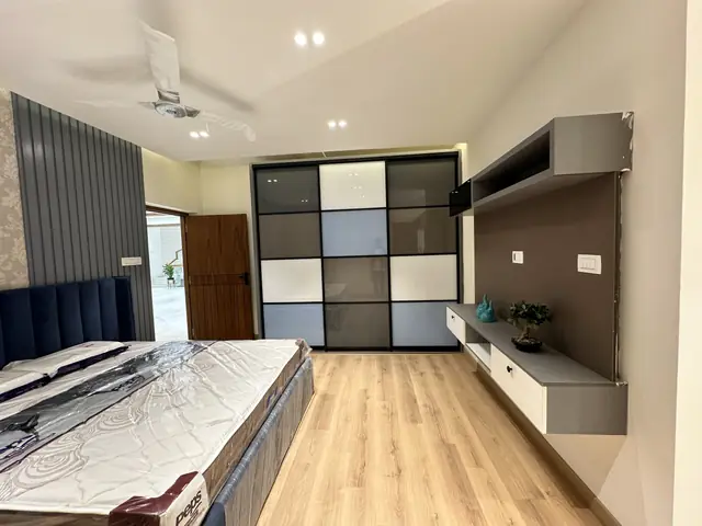 Bedroom wardrobe with patterned glass shutters - Mr. Willfred project, Bangalore