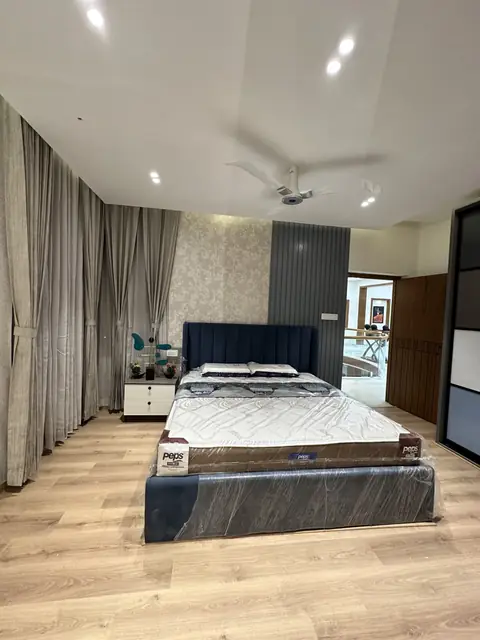 Bedroom with laminated wooden flooring installed - Mr. Willfred project, Bangalore