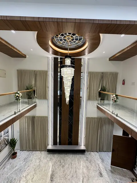 Chandelier suspended through double-height void - Mr. Willfred project, Bangalore