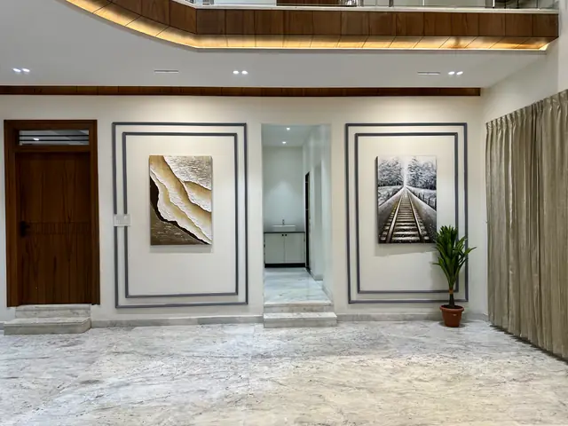 Corridor with framed art and marble flooring - Mr. Willfred project, Bangalore