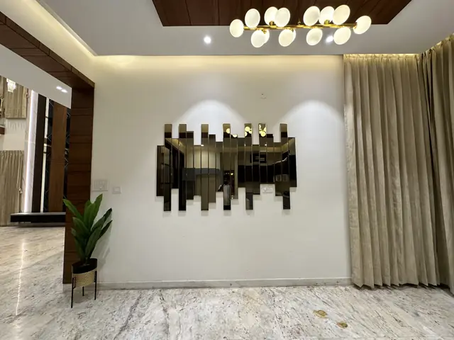 Living area feature wall with decorative mirror - Mr. Willfred project, Bangalore