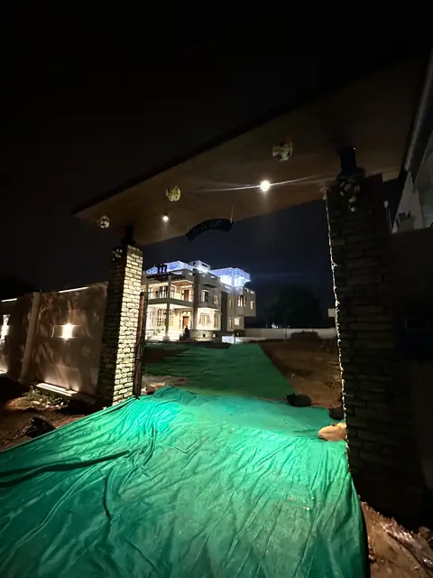 Illuminated facade viewed from the forecourt - Mr. Willfred project, Bangalore