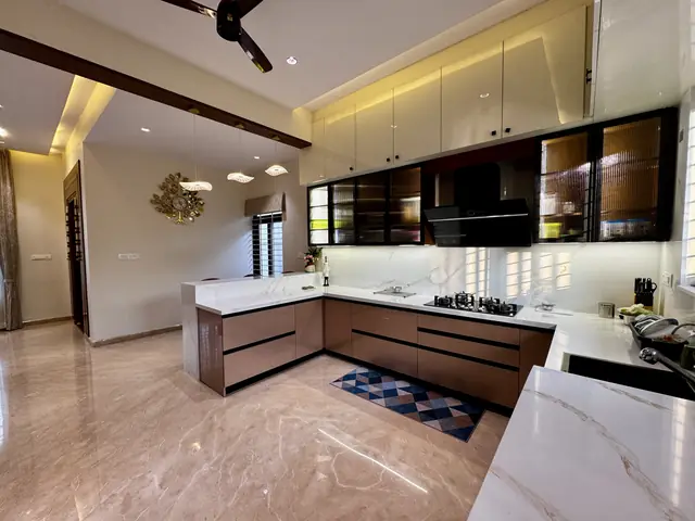 Open kitchen with stone countertop and chimney - Mrs. Anitha project, Bangalore