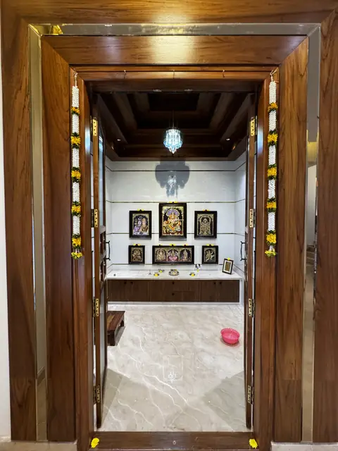 Carved timber pooja room doorway - Mrs. Anitha project, Bangalore