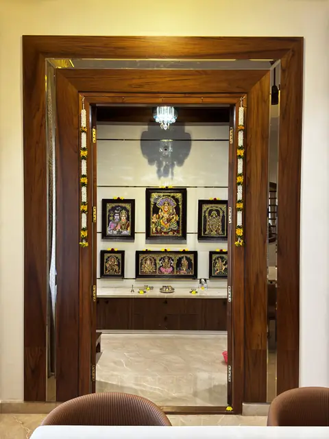 Pooja room framed in wooden jaali - Mrs. Anitha project, Bangalore
