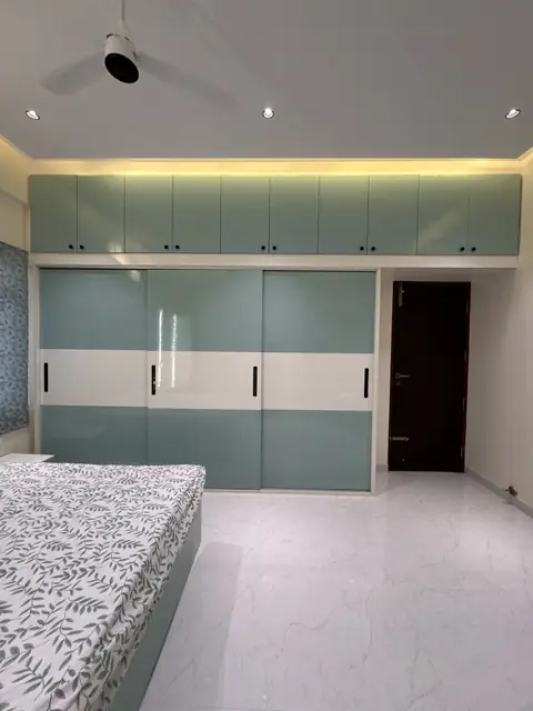 Bedroom wardrobe run with glass shutters - Mrs. Anitha project, Bangalore