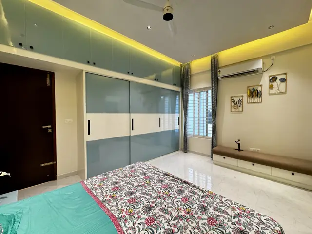 Bedroom wardrobes with frosted glass shutters - Mrs. Anitha project, Bangalore