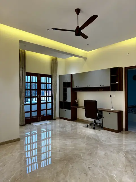 Study desk viewed across polished flooring - Mrs. Anitha project, Bangalore