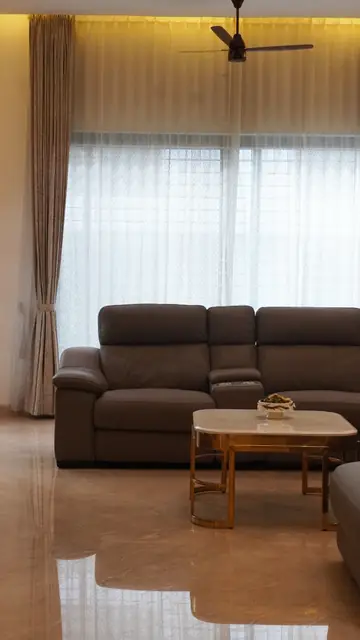 Living room sofa near curtained window - Mrs. Anitha project, Bangalore