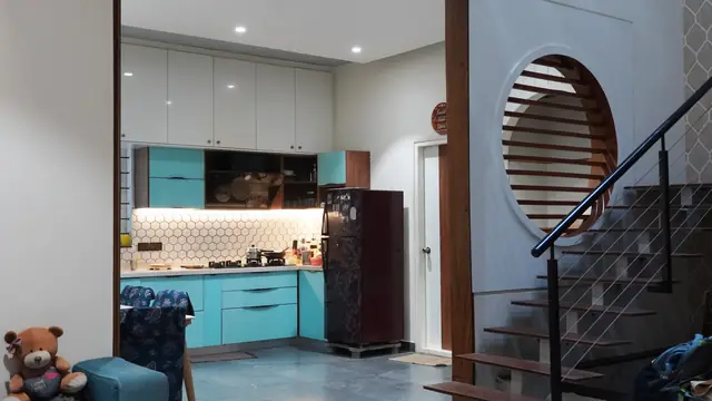 Kitchen with staircase visible beyond - Mrs. Anitha project, Bangalore