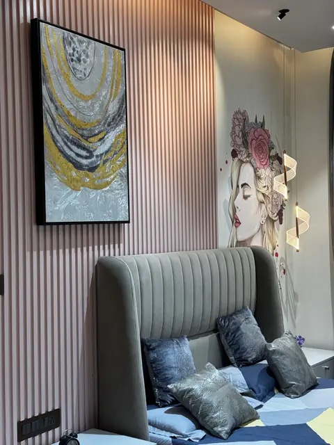 Framed art and fluted panelling behind bed - Ms. Rashmi project, Bangalore